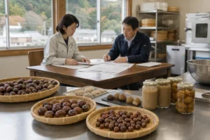 ヨシムラ・フードHDによる小田喜商店買収を表す栗加工現場の承継会議